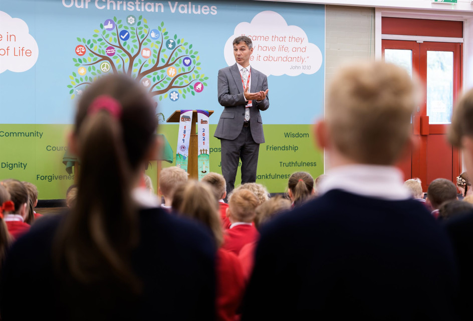 Children gathered for collective worship in the school hall